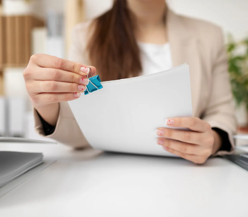 employee clipping papers